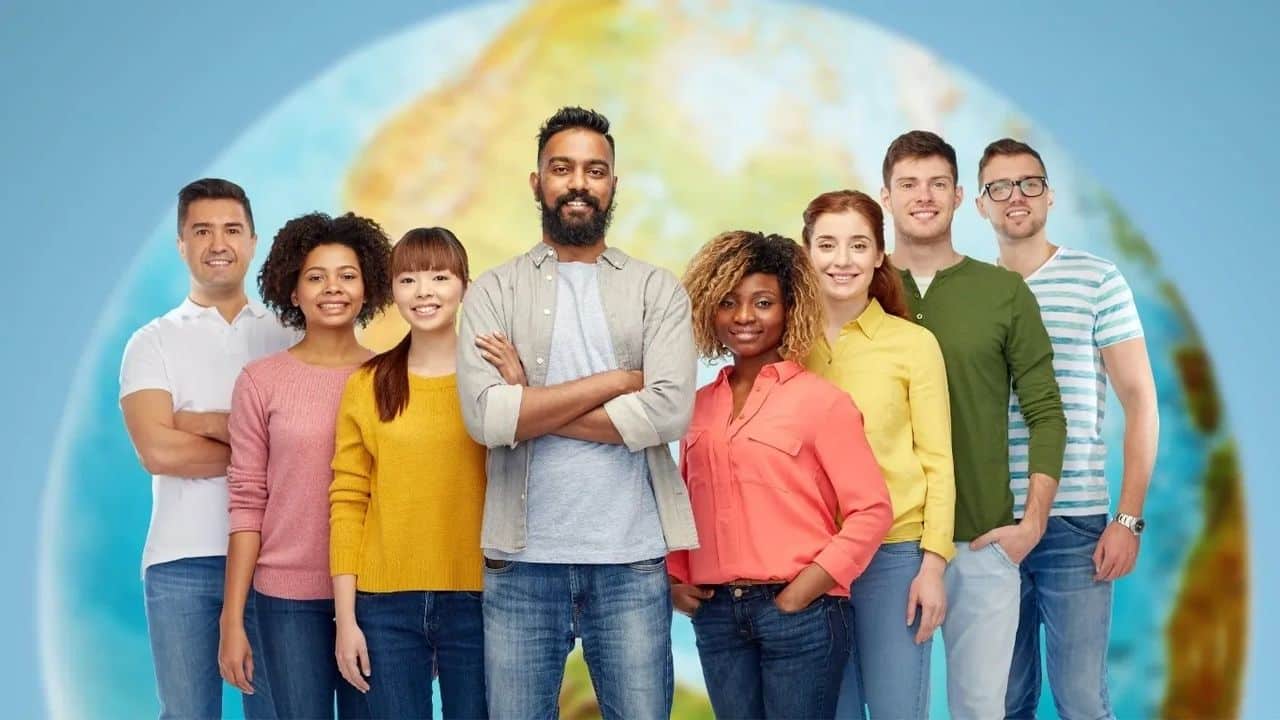 How to team lead across continents and time zones photo of many people from across the world in bright casual clothing