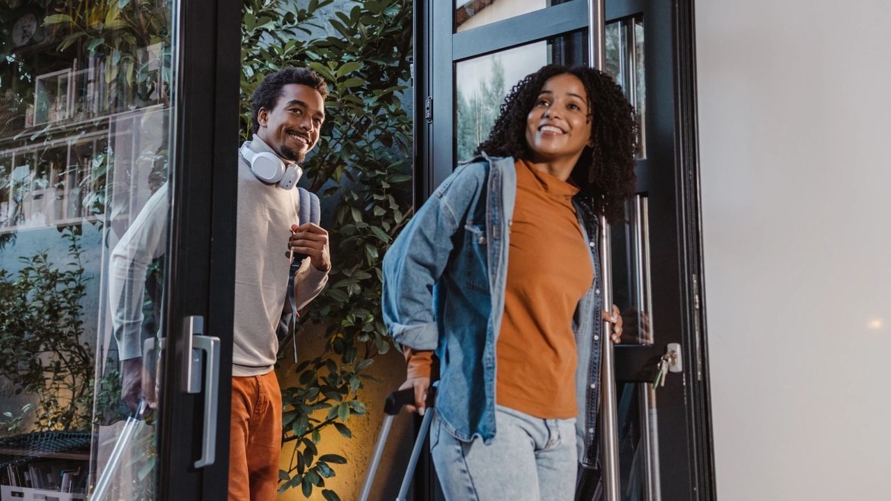 Sure strategies to adapt successfully to a new country, a couple entering their new apartment looking happy